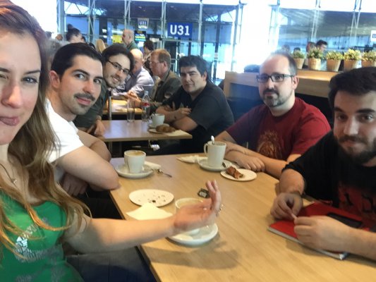 Abylight team at the airport, having breakfast